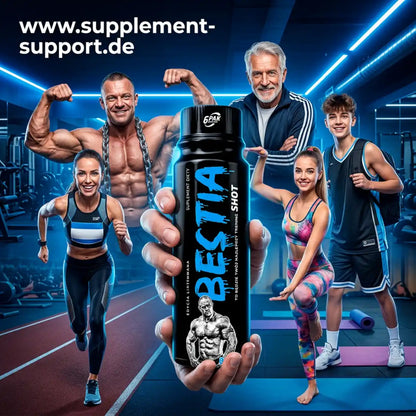 TREC NUTRITION Bestia Pre Workout Shot in einer Hand, umgeben von Sportlern im Fitnessstudio.