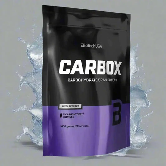BiotechUSA Carbox Kohlenhydrate Drinkpulver 1000g, schwarze Tüte vor Wasserspritzer