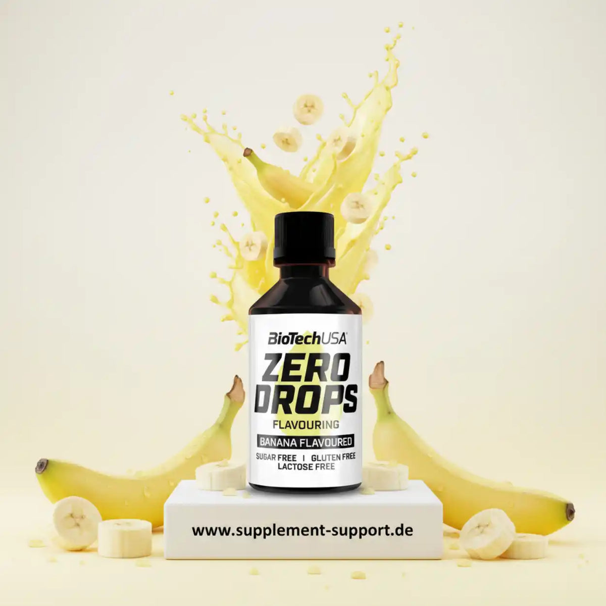 BioTechUSA Zero Drops Banane Geschmack Aromatropfen vor Bananen und einem gelben Spritzer