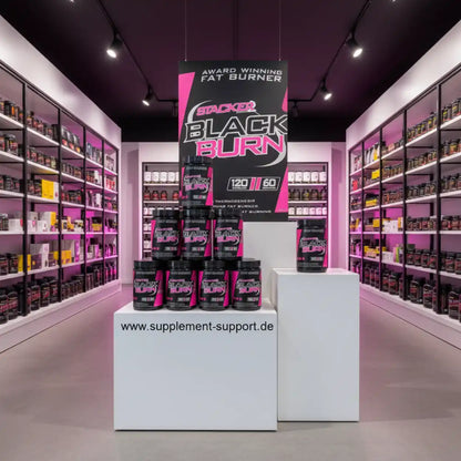Stacker Black Burn Fat Burner in Supplement Store mit pinker Beleuchtung und Regalen voller Nahrungsergänzungsmittel